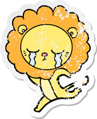 distressed sticker of a crying cartoon lion