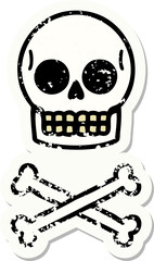 traditional distressed sticker tattoo of a skull and bones