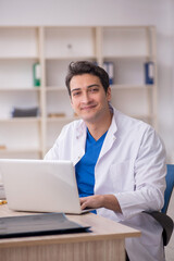 Fototapeta na wymiar Young male doctor in telemedicine concept