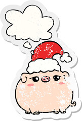 cartoon pig wearing christmas hat and thought bubble as a distressed worn sticker