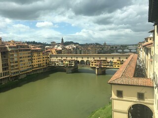 Ponte vecchio bridge, tuscany, florance with arno river, sunlights, colorful buildings