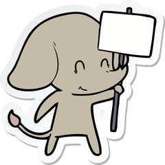 sticker of a cute cartoon elephant with sign