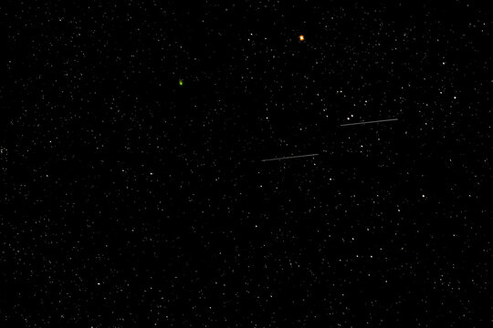 Feb 14-15 2023 the rare green comet C/2022 E3(ZTF) made its closest pass by Aldebaran. The two share the night with twin meteors. 4 sec f/1.8 ISO 1600 Sony FE 135mm f/1.8 GM Sony a7R IVA