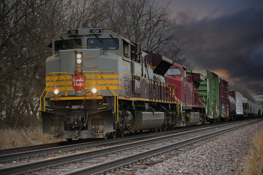 A pair of locomotives led by a specially painted Canadian Pacific Railway heritage unit power a freight train through northeastern Illinois destined for Iowa. 