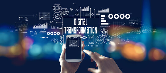 Digital transformation and technological revolution concept with person using a smartphone in a city at night