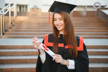 Woman portrait on her graduation day. University. Education, graduation and people concept.