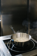 Cooking caramel in a saucepan on inductive cooking surfaces.