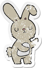 distressed sticker of a cute cartoon rabbit