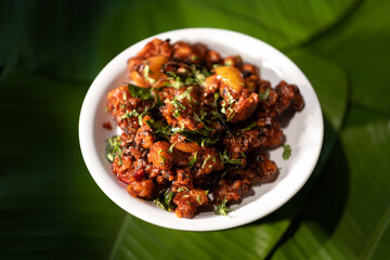 A serving of 'gobi 65', a vegetarian dish made from fried cauliflower and based on the 'gobi chicken' recipe originating from southern India.