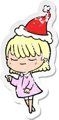 distressed sticker cartoon of a woman wearing santa hat