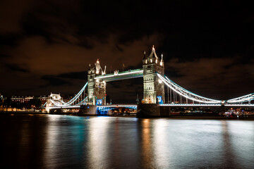 Fototapeta na wymiar Tower Bridge Illuminated at Night, London's Iconic Landmark Lighting Up the River Thames