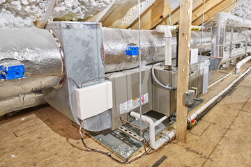 Gas furnace, supply lines and ductwork in an insulated but unfinished attic