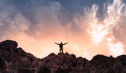 Having winning mindset. Man celebrating a on mountain top. 