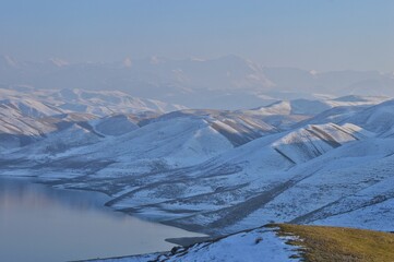 Snow-covered hilltops of the mountain ranges of the Pamir Mountains Asia 