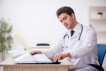 Young male doctor radiologist working in the clinic
