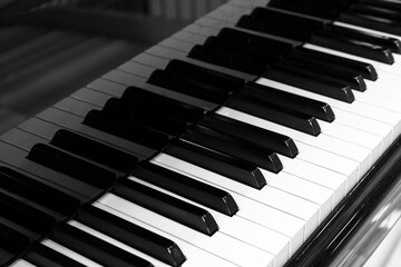Close up of piano keyboard. Music instruments. Copy space. Black and White Piano Keys Taken From Above as a Flat Lay Image. Piano keys side view with shallow depth of field