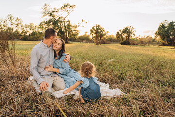 Young couple with cute two-years-old girl