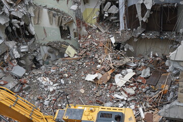 remnants of partially destroyed building, debris, demolition