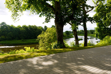 Latvian summer nature, view of the river, trees and the city