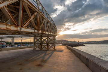 Naklejka premium View of Avci ramadan park from aliaga izmir, colorful lighthouse and iron bridge shoted in different times and light conditions with landscape concept idea