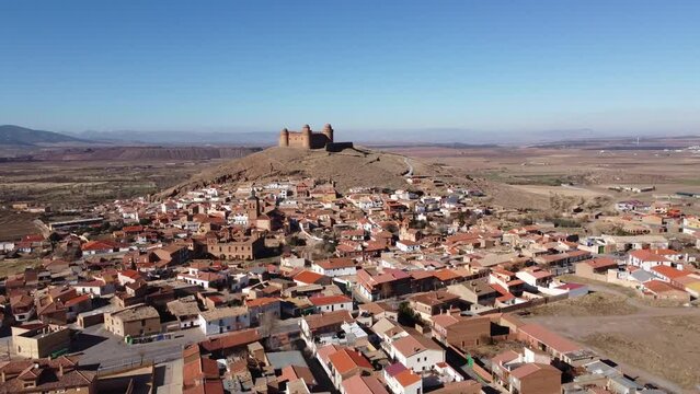 Aerial view of La Calahorra castle, showcasing its Renaissance courtyard, situated near Granada in Andalusia, Spain. This location is featured in the TV series The House of the Dragon, Pentos Castle
