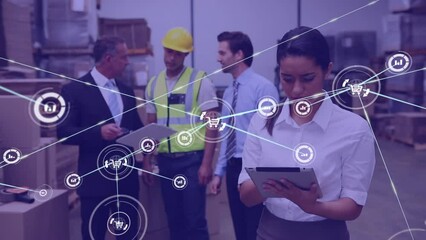 Animation of network of icons over biracial female supervisor using digital tablet at warehouse - Powered by Adobe