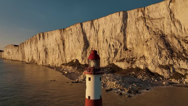 Lighthouse on the water. Beautiful aerial landscapes around Seven sisters cliffs in the English Channel. Amazing drone footages, on the coast of Sussex. Sea, ocean ,rock, mountain and sunset. 