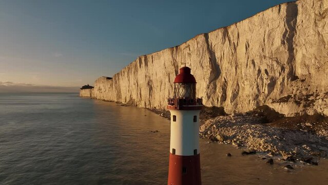 Lighthouse on the water. Beautiful aerial landscapes around Seven sisters cliffs in the English Channel. Amazing drone footages, on the coast of Sussex. Sea, ocean ,rock, mountain and sunset. 