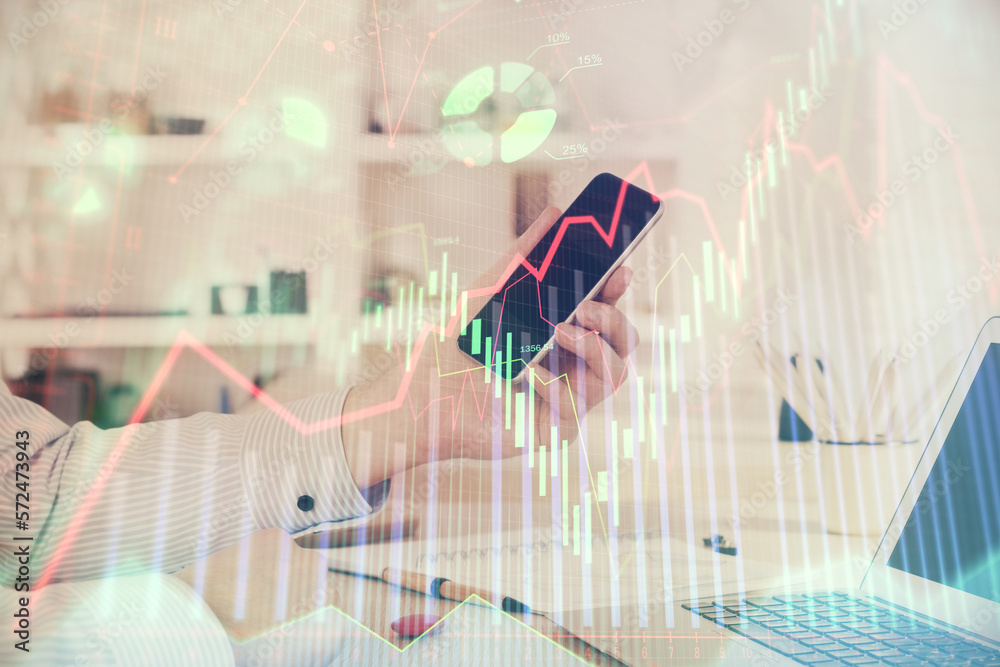 Aufkleber double exposure of man's hands holding and using a digital device and forex graph drawing. financial