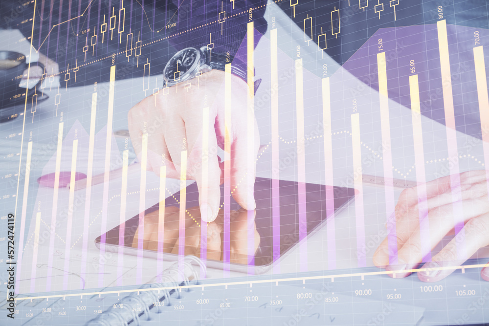 Poster double exposure of man's hands holding and using a digital device and forex graph drawing. financial