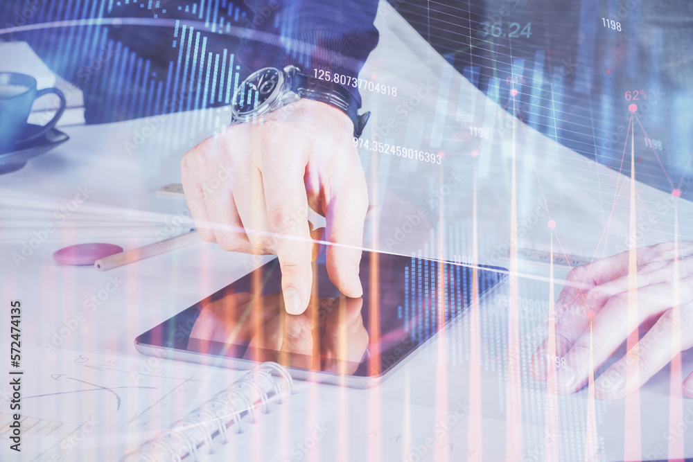 Poster double exposure of man's hands holding and using a digital device and forex graph drawing. financial