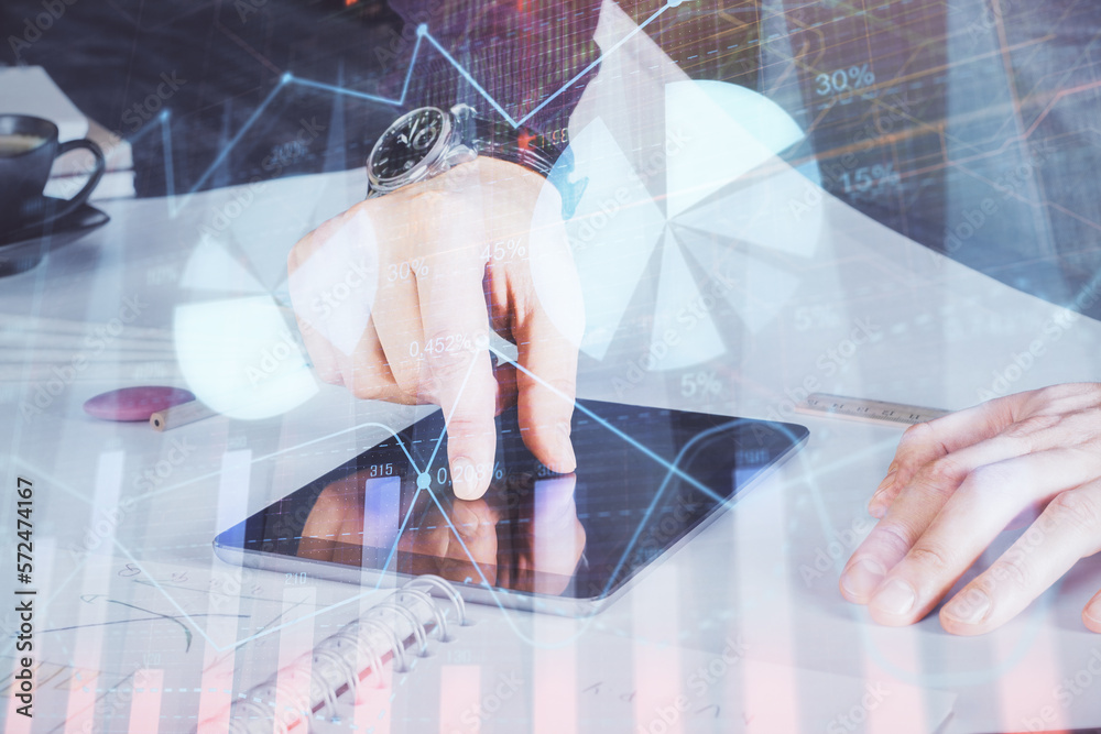 Poster double exposure of man's hands holding and using a digital device and forex graph drawing. financial