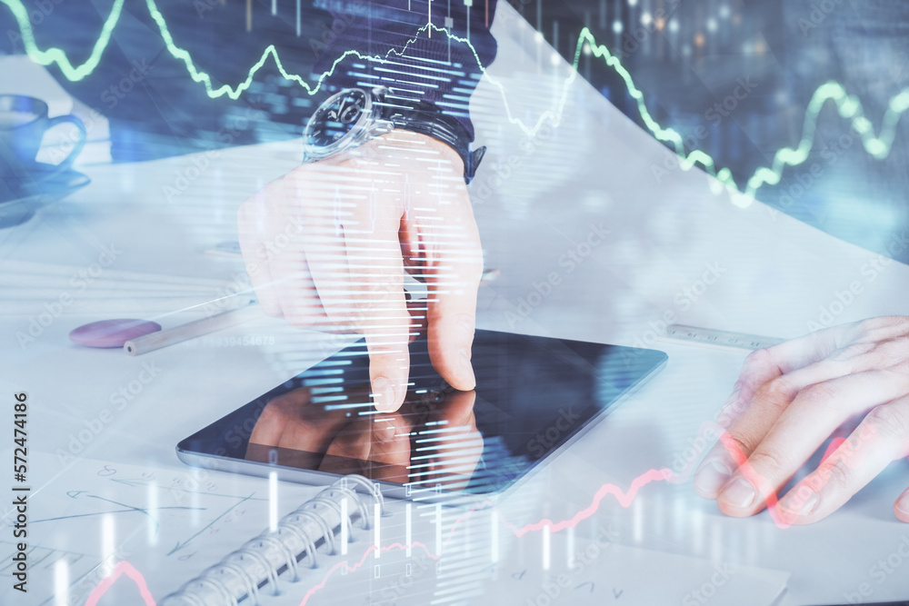 Poster double exposure of man's hands holding and using a digital device and forex graph drawing. financial
