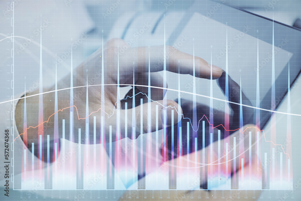 Poster multi exposure of man's hands holding and using a phone and financial chart drawing. market analysis