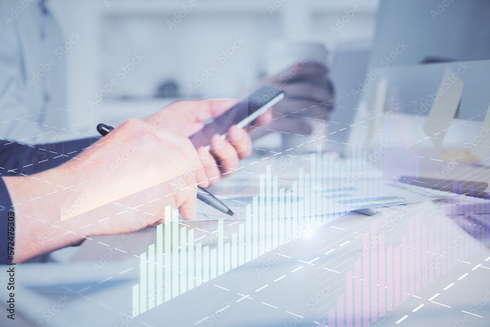 Poster double exposure of man's hands holding and using a phone and financial chart drawing. market analysi