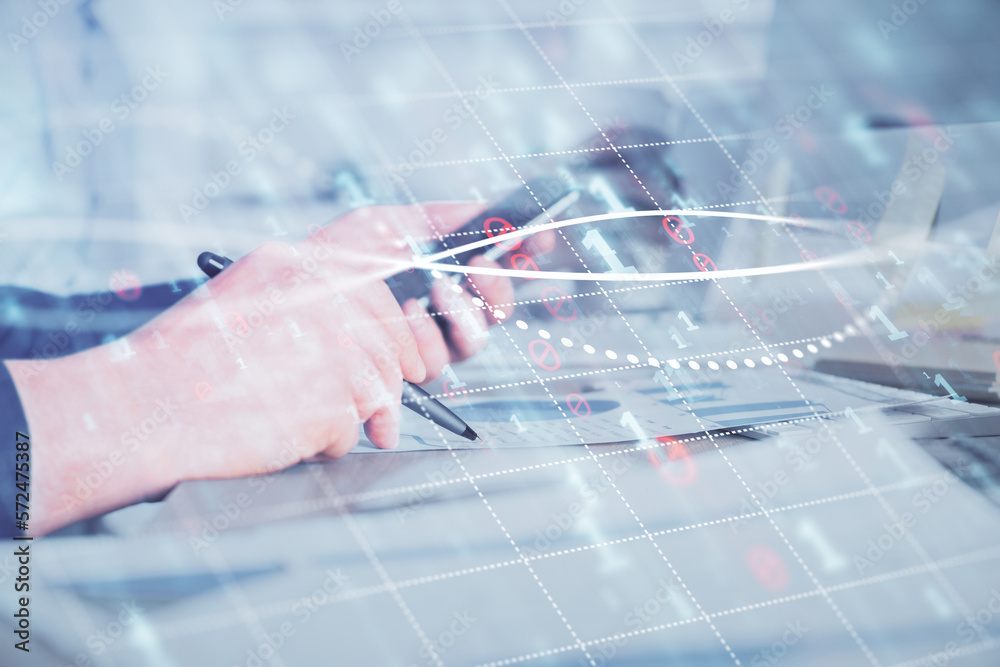 Poster double exposure of man's hands holding and using a phone and financial chart drawing. market analysi