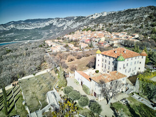 Castle in Aiguines village (Gorges du Verdon) and Sainte-Croix lake in the Provence-Alpes-Côte...