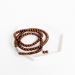 Chocolate pearls on white backgrop