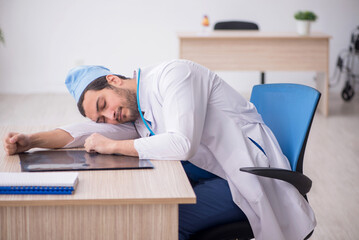 Young male doctor working in the clinic