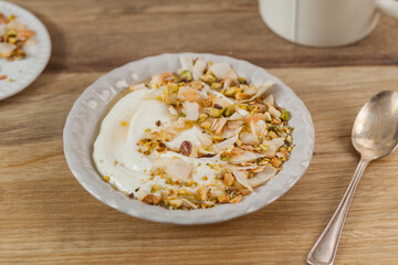 Delicious Yogurt in a bowl with nuts