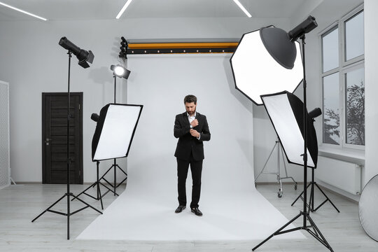 Handsome model posing in modern studio. Professional photo session