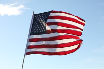 Fototapeta premium American flag fluttering outdoors on sunny day