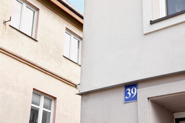 Fototapeta na wymiar Plate with house number thirty nine on beautiful building outdoors