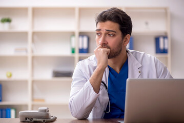 Young male doctor working in the clinic