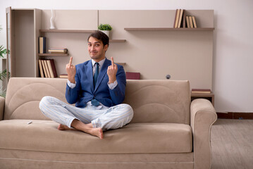 Young male employee working from home during pandemic