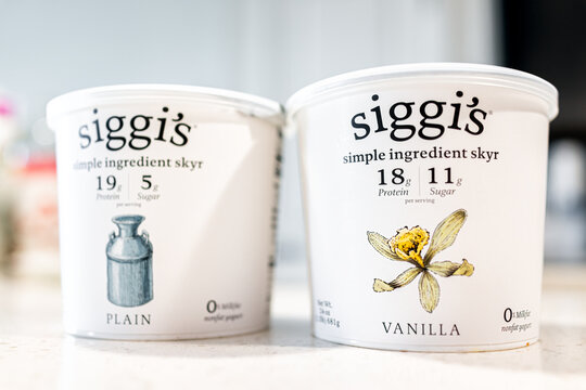 Naples, USA - February 7, 2022: Siggi's sky yogurt of vanilla, plain flavors Scandinavian style yoghurt macro closeup of milk dairy plastic food container