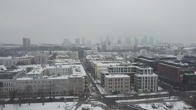 Drone video of warsaw city skyline on a snowy and foggy day7