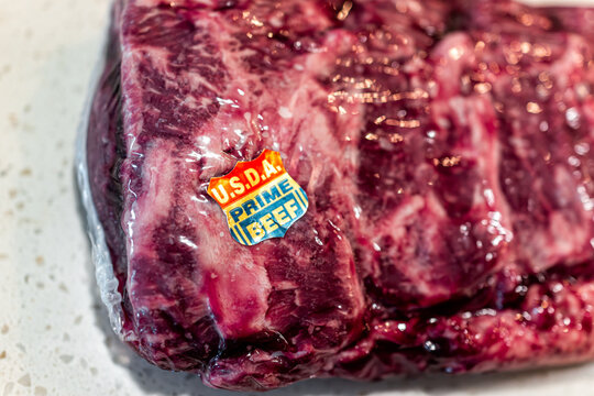 Naples, USA - May 11, 2022: Prime USDA beef sticker on whole packaged roast New York strip red meat steak by Costco bulk brand