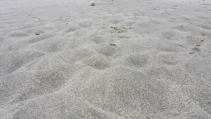 Fototapeta na wymiar sand texture background, close shot beach sand dunes