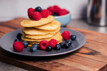 Stack of homemade pancakes for breakfast with berries